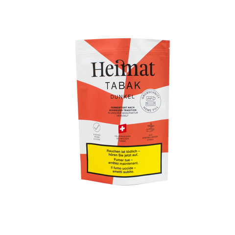 Sachet avec Heimat tabac à rouler foncé, tradition suisse, design rouge et blanc, avertissement, idéal pour les amateurs de tabac.