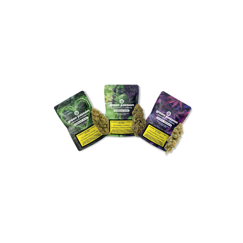 Three packages of Green Passion CBD flowers labeled 'Passion Haze' with cannabis buds placed in front of each package.