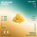 Yellow sugar wax with a grainy texture, labeled as Swiss made CBD dab, containing 90% CBD, 0.99% THC, and 1.8% CBG, with herbal and fruity flavor.